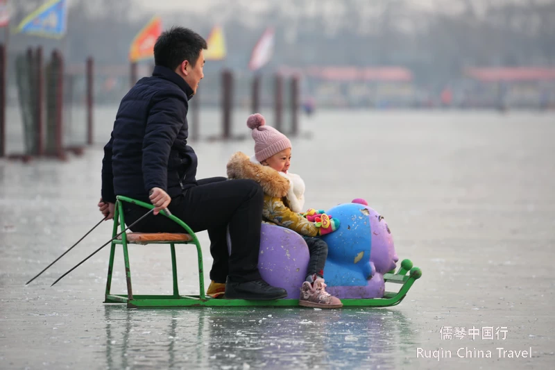 Riding Ice Chairs on Houhai lake ice rink