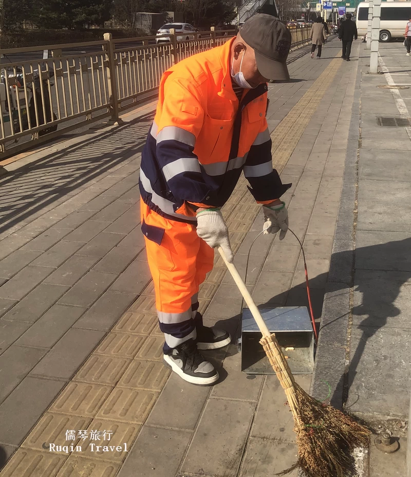 Mr. Zhong at work the street cleaner in Beijing