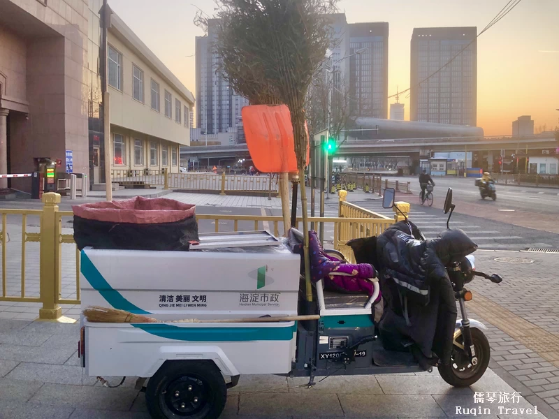 Street Cleaners in Beijing Equipped with a cart, a shovel and either a bamboo or sorghum broom.