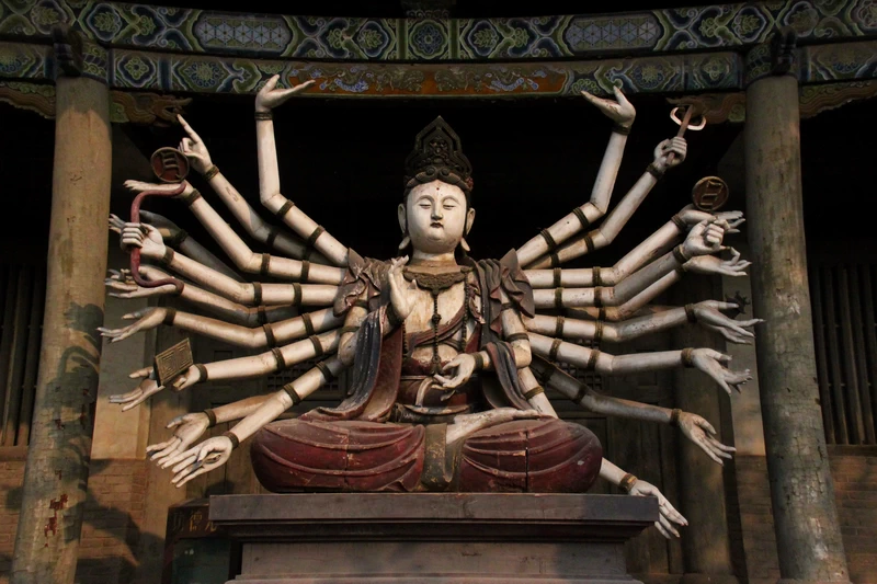 Bodhisattva carved with several arms at Shuanglin Temple