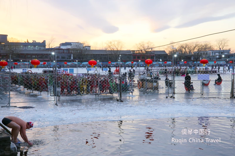 Skating,swimming or hitting the ice with Ice Bikes, and Ice sled-like chairs on the Shihahai lakes in January Beijing