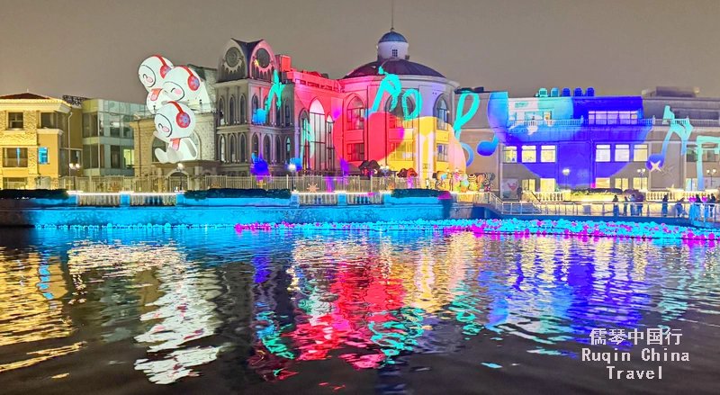 buildings along the Liangma river and bridges light up in dreamlike colors,