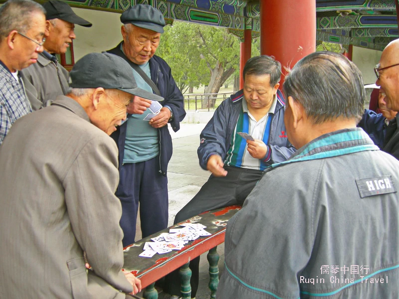 Seniors playing Chinese cards at Temple of Heaven