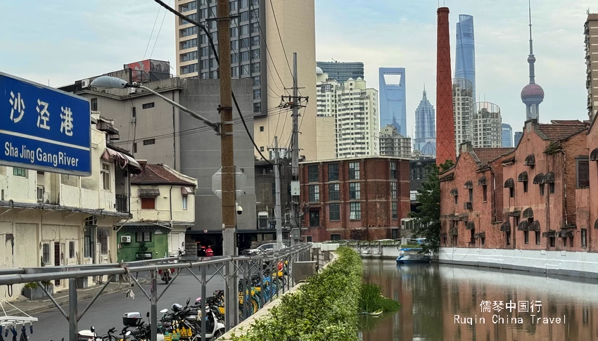 The smokestack stood boldly in front of the glimmering skyscrapers of Lujiazui