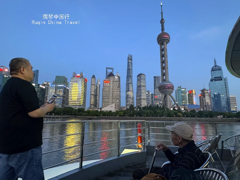 Passing by the core of Lujiazui during the golden "blue hour"  from Shiliupu Harbour
