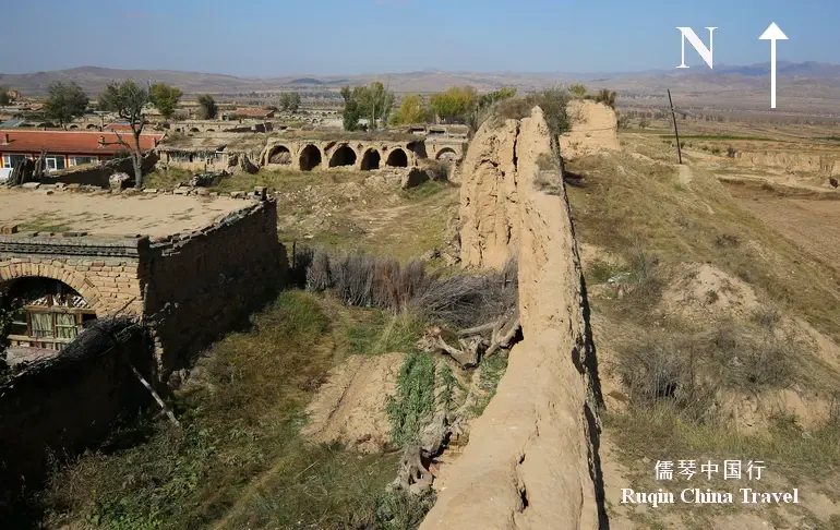 The east side of the rammed earth wall at the Zhenbianbu Fortress
