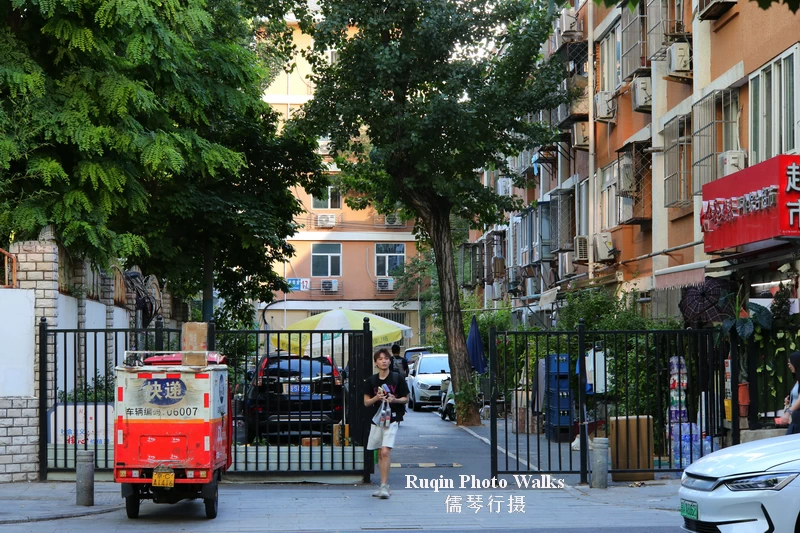 The older residential-style buildings on west side of Jintong East Road