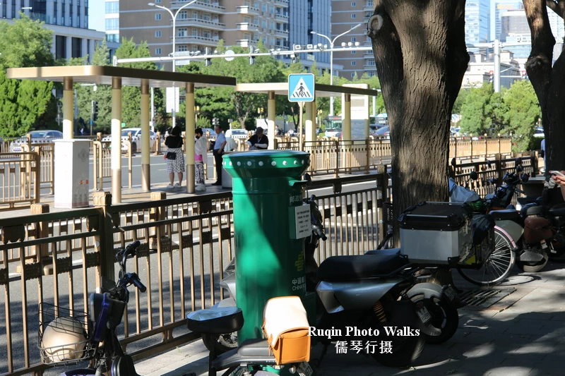  a green postal box. on the sidewalk of Jianguomen Outer Avenue, Beijing