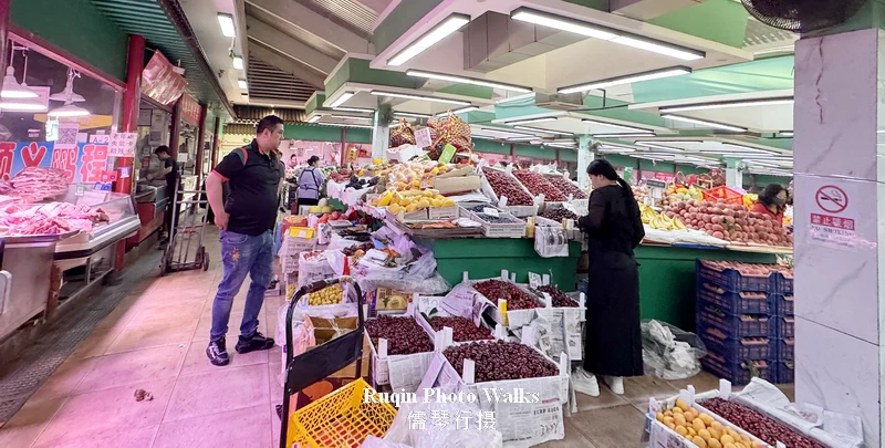 Inside the market, stalls were filled with fresh fruits, vegetables, and meat.