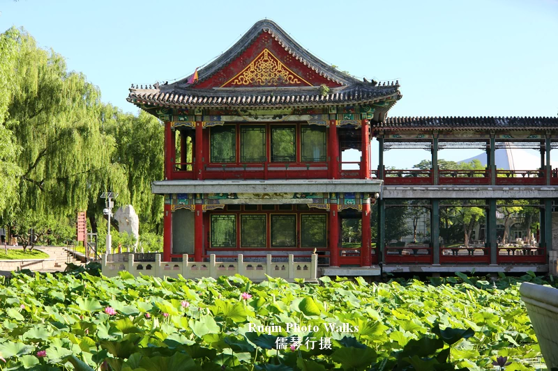A stone boat rests quietly near the southern edge of the pond in Longtan Lake Park