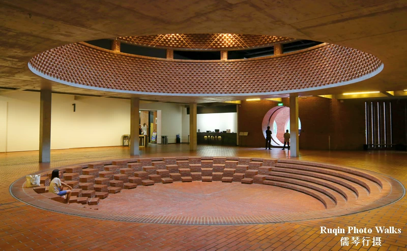 The Circular Forum Hall of Beijing Red Brick Art Museum like a small amphitheater wrapped in red brick.