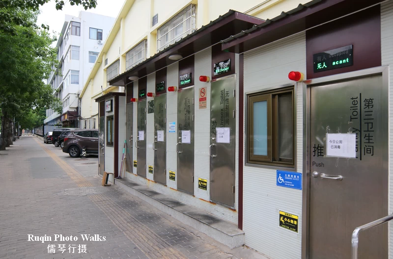 a row of temporary public toilets on Tiyuguan Road
