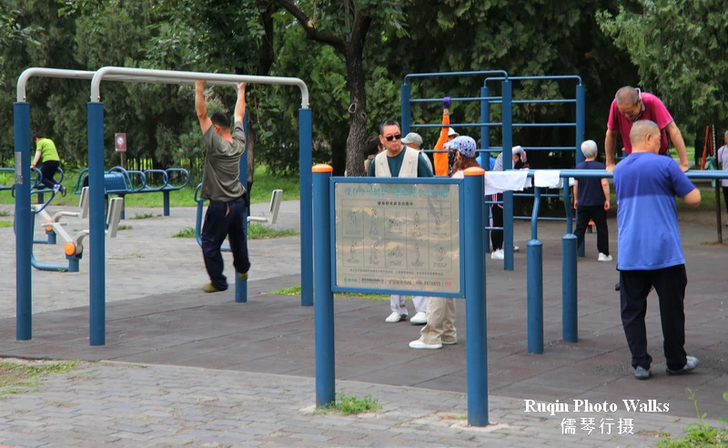 Seniors using fitness equipment in Temple of Heaven Park