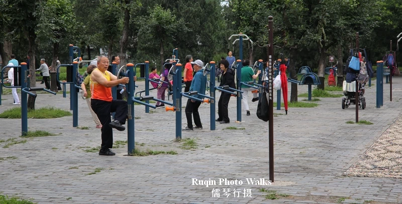 Seniors stretching at the outdoor fitness area in Temple of Heaven Park