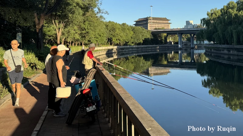 People Jogging and Fishing along the City Moat at Dongbianmen in Beijing