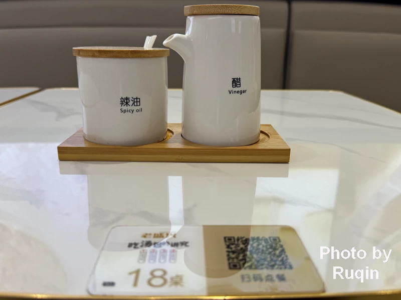 I sat at Table 18. A small QR code was fixed to the tabletop at Guangqumen Lao Sheng Xing Dumpling Resuarant, Beijing