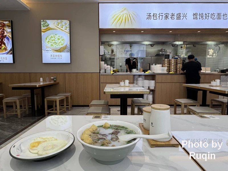 a bowl of duck-blood vermicelli soup, and two fried eggs at Laoshengxing Restaurant in Beijing