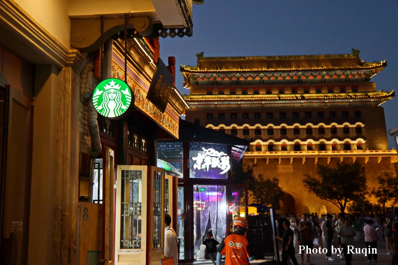 Side view of Starbucks with Zhengyangmen in the background